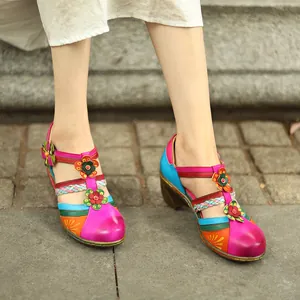 Detail shot of vintage colorful Mary Jane wedge sandals with bright flower accents