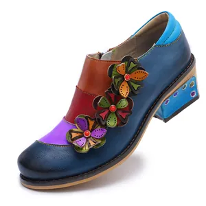 Detailed view of retro color-block Brogue shoes with 3D leather flower embellishments.