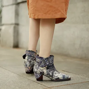 Side view of Chinese vintage landscape print ankle boots with chunky heel and buckle.