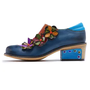 Detailed side view of vintage color-blocking Brogue shoes with floral leather appliques