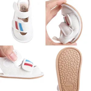 White baby mesh pre-walker shoes with flexible non-slip soles and adjustable Velcro straps.