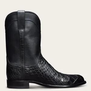 Vue latérale de bottes de cowboy noires avec cuir crocodile embossé et tige lisse