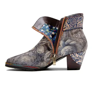 Detailed side view of a vintage Chinese style ankle boot with landscape floral patterns