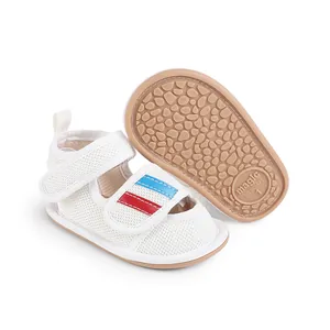 Detailed view showing the textured anti-slip sole and white mesh of baby pre-walker shoes