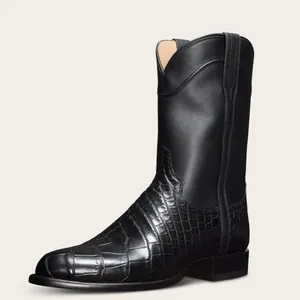 Vue détaillée de bottes de cowboy western vintage noires pour hommes avec motif crocodile.