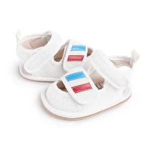 White mesh baby walking shoes with blue and red stripe details on velcro straps