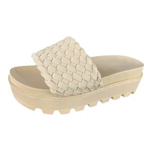 Stylish beige woven platform slippers with comfortable thick sole for summer beach wear.