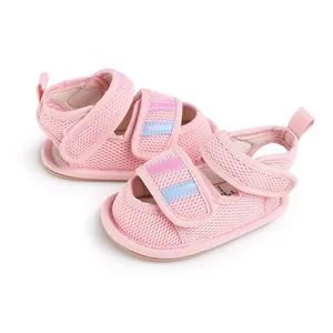 Detailed macro shot of pink breathable mesh baby walking shoes with adjustable Velcro straps