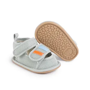 Detailed view of grey mesh baby pre-walker shoe with non-slip soft sole