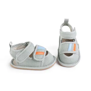 Grey mesh infant walking shoes with blue and orange velcro straps for toddlers