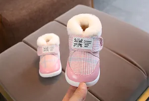Pink plaid baby snow boots with faux fur lining and Velcro strap detail