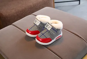 Plaid infant snow boots with warm faux fur lining and red accents for toddlers