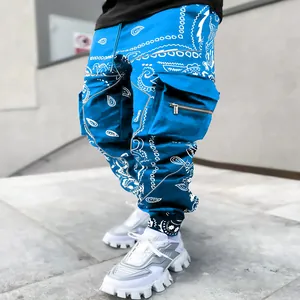 Close-up showing the detail of blue bandana paisley print on high street cargo pants