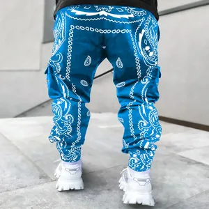 Detail of men's blue paisley cargo harem pants with multi-pocket design