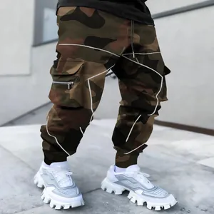 Close-up view of men's camouflage cargo joggers featuring a multi-pocket streetwear design