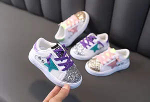 Detailed view of girls' breathable mesh sneakers with shiny sequins and star patch