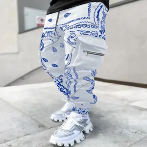 Detail of men's paisley harem cargo pants with multiple pockets in blue and white.