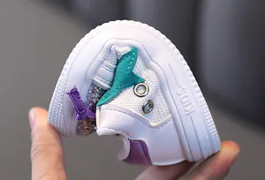 Detail view of the soft and flexible rubber sole on a girls sequin fashion sneaker