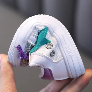 Flexible soft sole kids sneakers with sequin details and breathable mesh in white color.