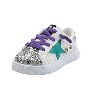 Breathable kids sneakers featuring shiny silver glitter and colorful purple laces.