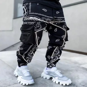 Men's stylish black paisley print cargo harem pants featuring white reflective piping