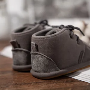 Detailed back view of grey suede baby boots featuring soft anti-slip rubber soles