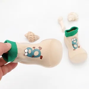 Detail shot of breathable baby walking shoes with soft soles and cute cartoon B