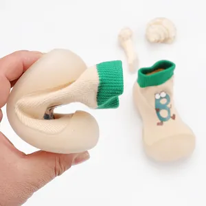 Close-up showing the flexible soft rubber sole of breathable baby walking sock shoes