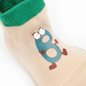 Close-up of breathable knit toddler sock shoes with cute cartoon number pattern