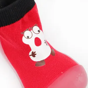 Close-up detail of red breathable toddler sock shoe with a cute cartoon character print