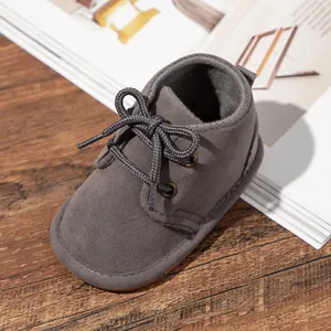 Soft gray suede anti-slip baby walking shoes with a secure lace-up design for infants