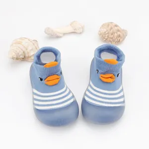 Detailed view of blue cartoon duck baby floor sock shoes featuring soft non-slip rubber soles