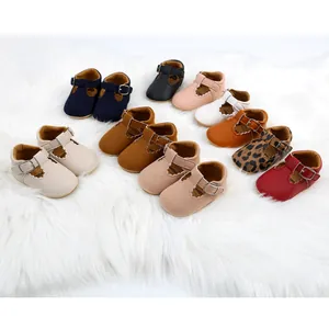 Collection of multi-colored baby princess walking shoes for girls on white fur