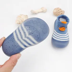 Blue baby indoor walking shoes with cartoon duck design and non-slip soft rubber sole