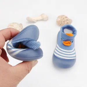 Soft and flexible sole demonstration of blue striped baby floor sock shoes.