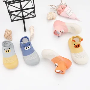 Detail view of breathable mesh baby walker shoes with cartoon faces in multiple colors