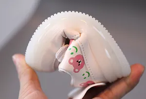 Close-up showing the extreme flexibility and soft sole of toddler walking shoes