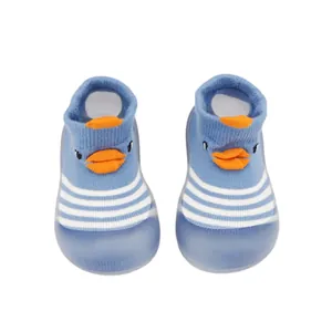 Blue baby cartoon duck walking shoes with soft rubber soles and striped knit socks