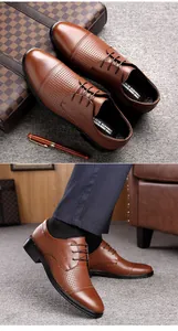 Detail view of men's brown breathable leather dress shoes with hollow-out pattern design