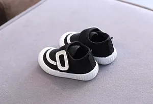 Detail view of black mesh breathable baby toddler shoes with soft non-slip rubber soles.