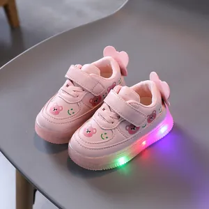 Toddler pink LED light-up sneakers featuring cute bear prints and adjustable velcro straps