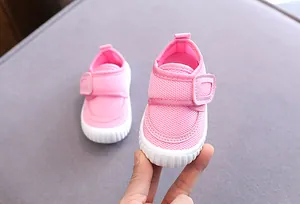 Close-up of pink breathable mesh baby walking shoes with soft non-slip rubber soles.