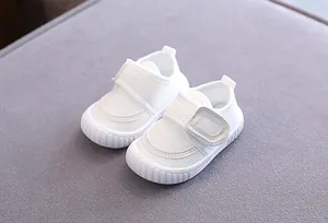 Breathable white infant walking shoes with soft non-slip sole and velcro strap