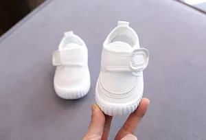 Detailed view of white breathable mesh baby walking shoes with soft sole