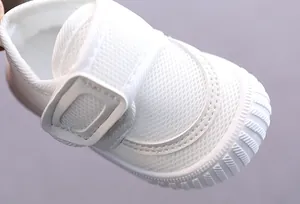 Detailed view of white breathable mesh baby walker shoe with secure velcro strap