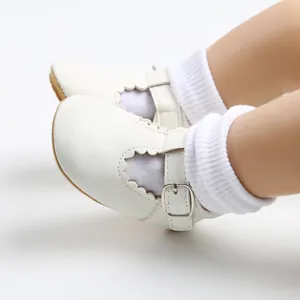 Elegant white baby Mary Janes with scalloped edges for toddlers learning to walk safely