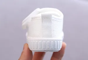 Detailed close-up showing the heel of a white breathable mesh baby walking shoe