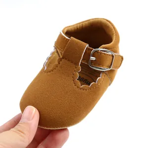 Detailed view of brown suede baby princess shoes featuring soft toddler walking soles