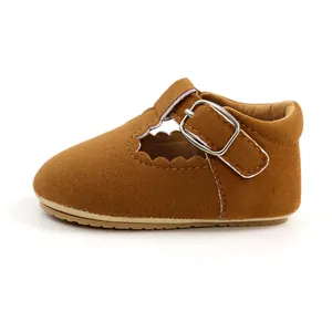 Side view of brown suede infant princess shoes with rubber sole and buckle strap