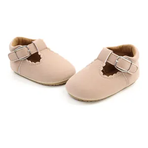 Detail of pink suede baby princess walker shoes with buckle strap.